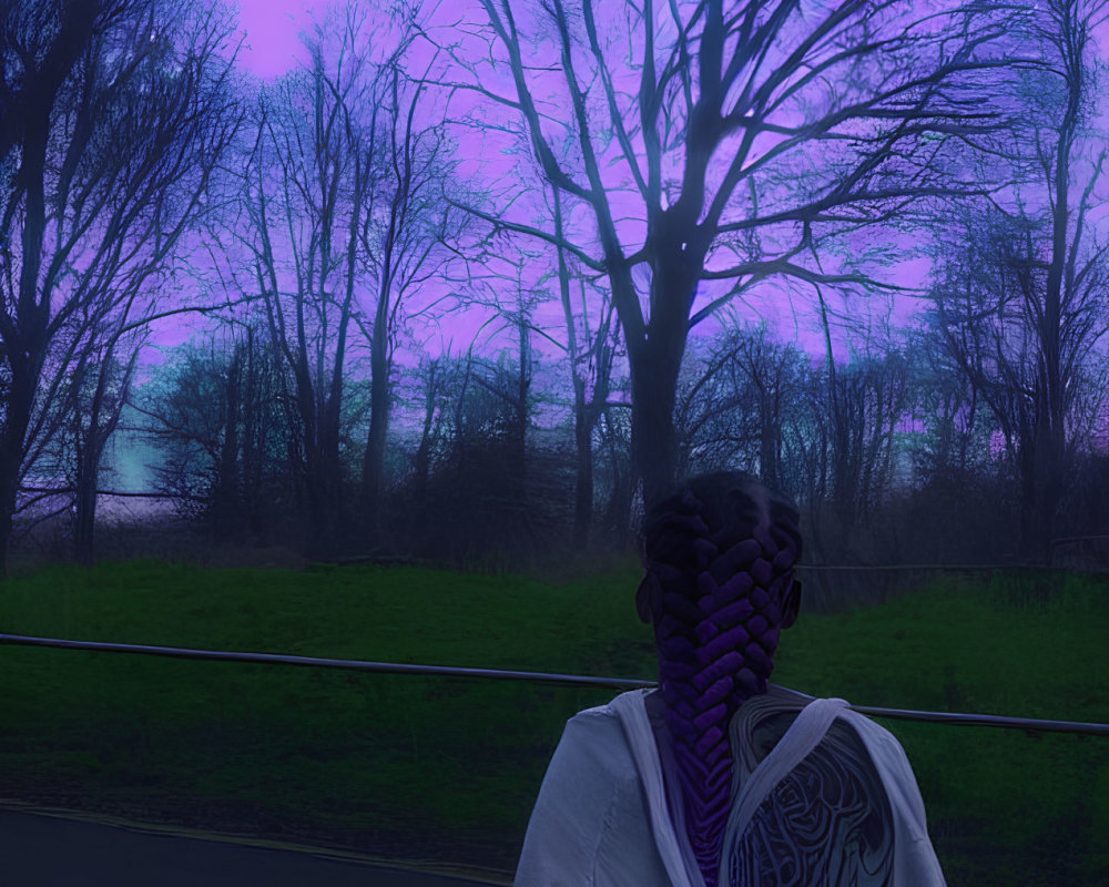 Patterned person on road with trees and dusk sky in background