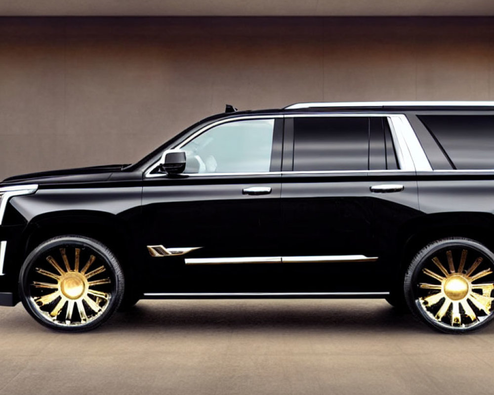 Black Luxury SUV with Shiny Golden Rims on Beige Background