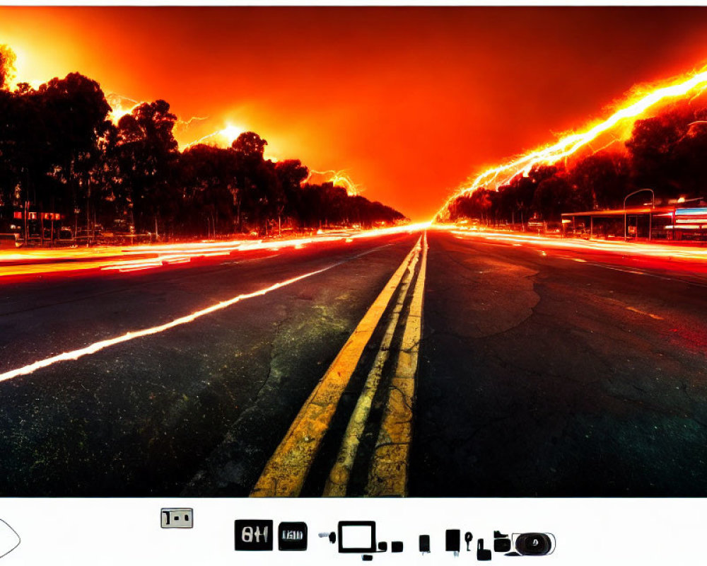 Deserted road at twilight with vibrant orange-red skies and red tail lights.