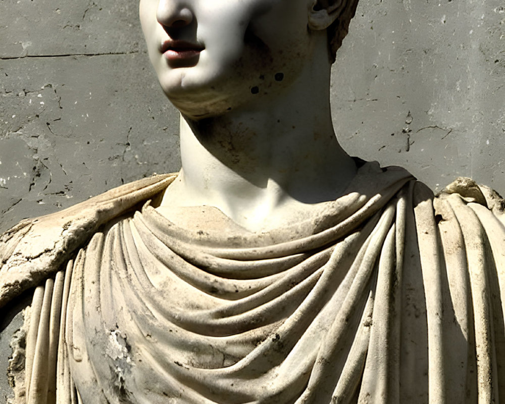 Detailed marble statue of a youthful male figure in classical clothing