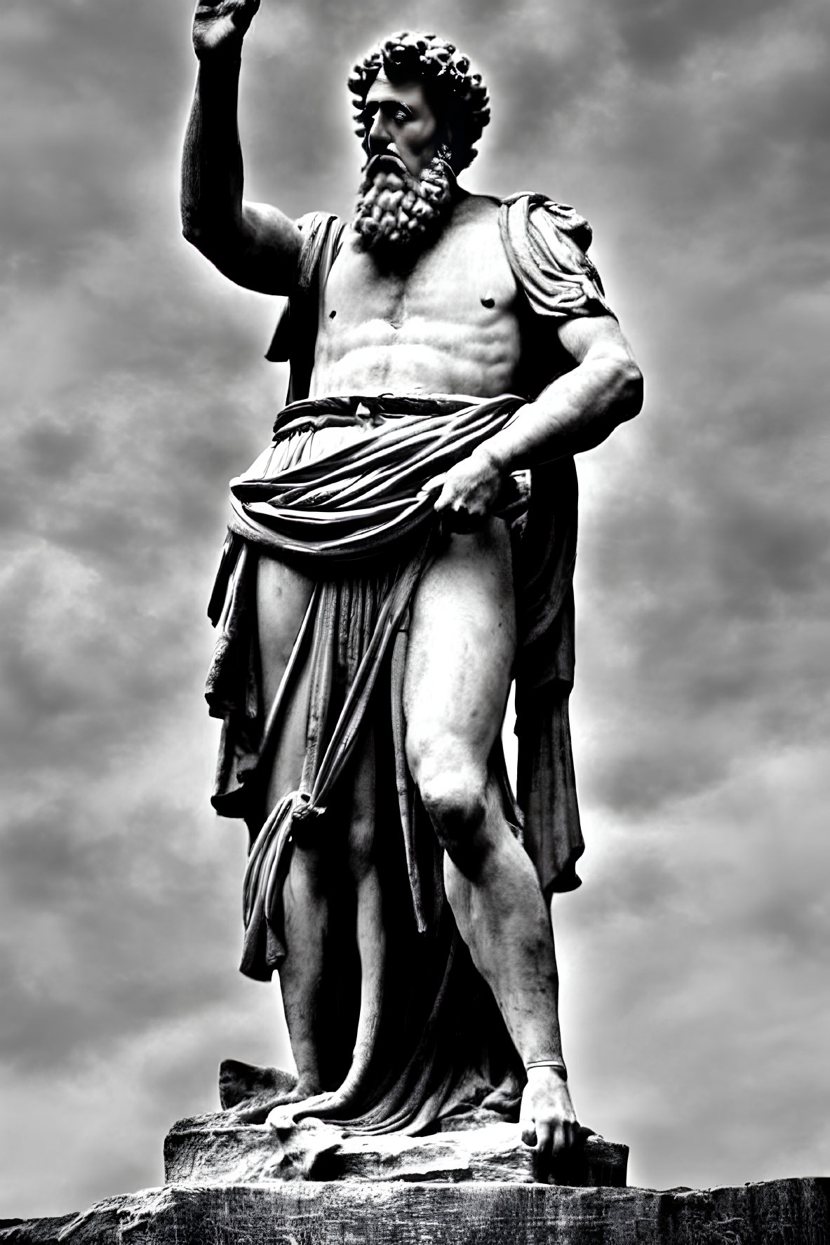 Monochrome photo of muscular bearded statue against dramatic sky