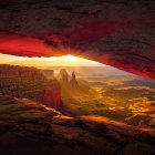 Majestic desert landscape with vivid sunset and starry sky