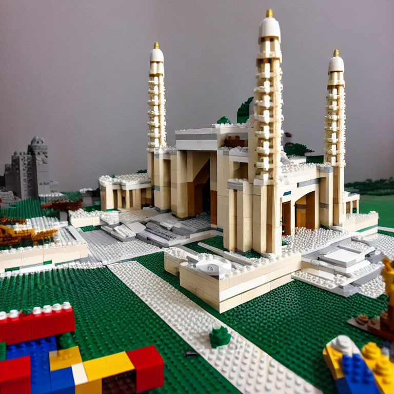 Detailed Lego model of grand building and colorful landscape.