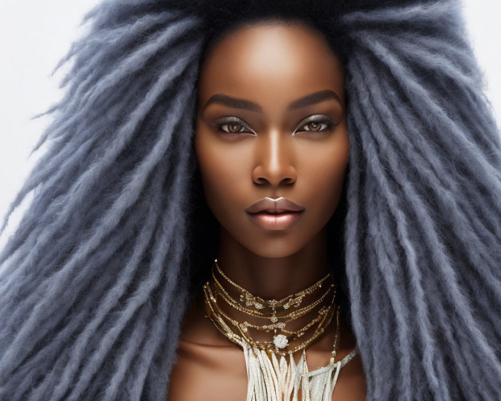 Striking Large Textured Hair Styled Upwards on Woman with Layered Necklaces