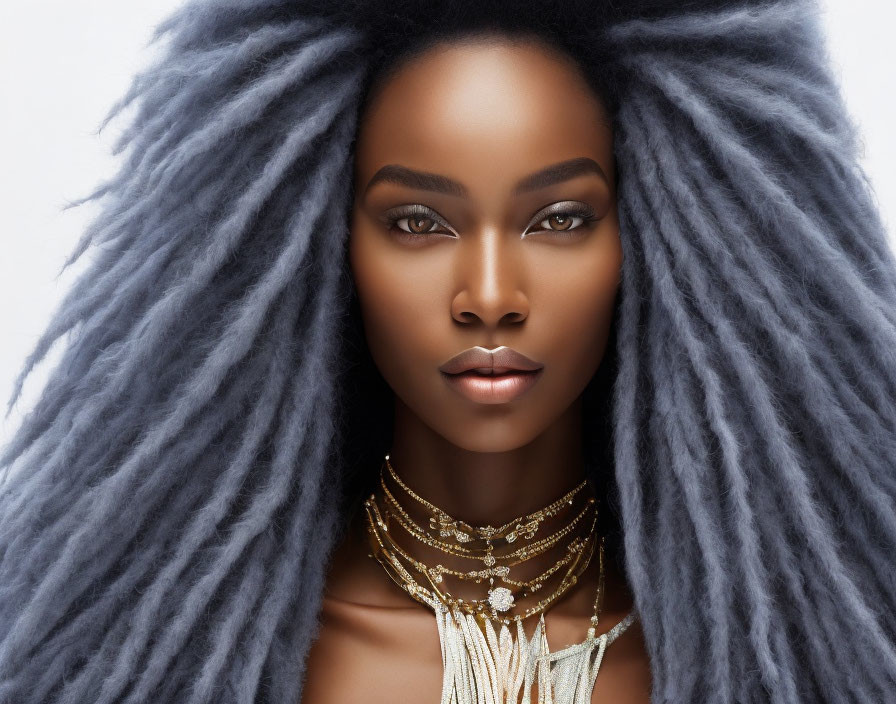 Striking Large Textured Hair Styled Upwards on Woman with Layered Necklaces