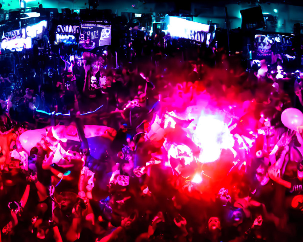 Crowd at Concert Under Blue and Pink Lights