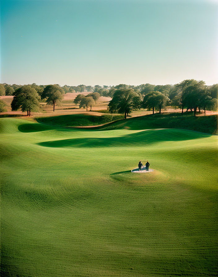 Scenic golf course with undulating fairways and sand bunker