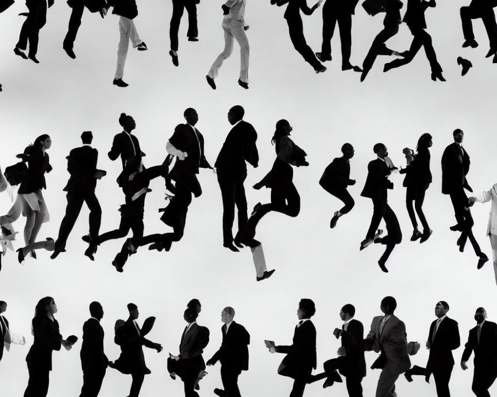 Diverse people in business attire silhouetted on white background