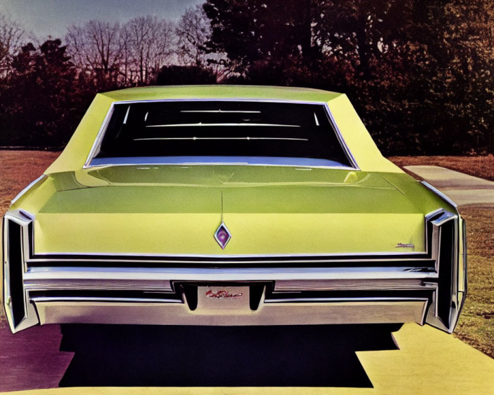 Vintage Green Car with Angular Design and Central Emblem Parked on Pathway