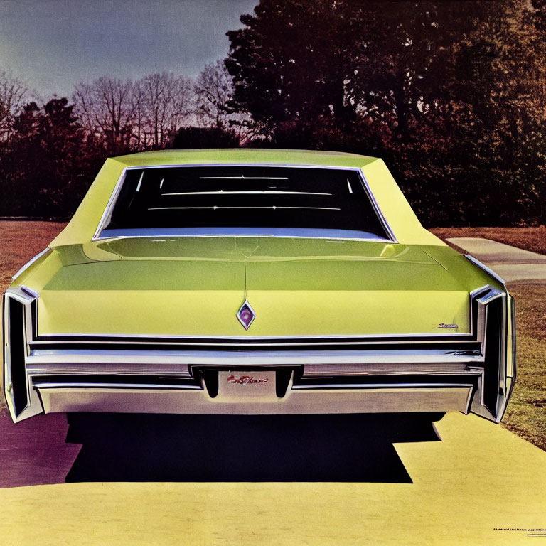 Vintage Green Car with Angular Design and Central Emblem Parked on Pathway