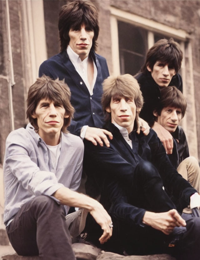 Vintage-Style Group Portrait: Five Men in Casual Poses with Shaggy Hairstyles