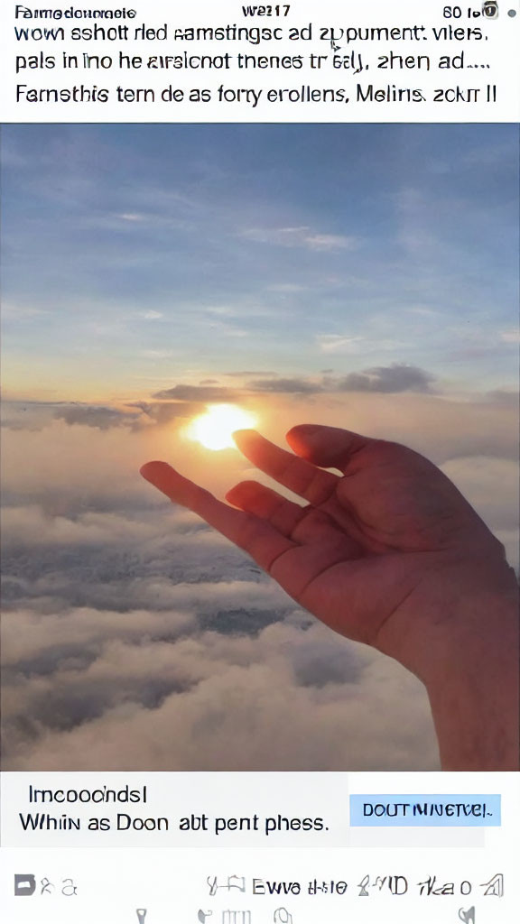 Silhouetted hand against cloudy sky with sunlight diffusing.