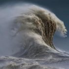 Powerful Wave Crashing in Stormy Sky