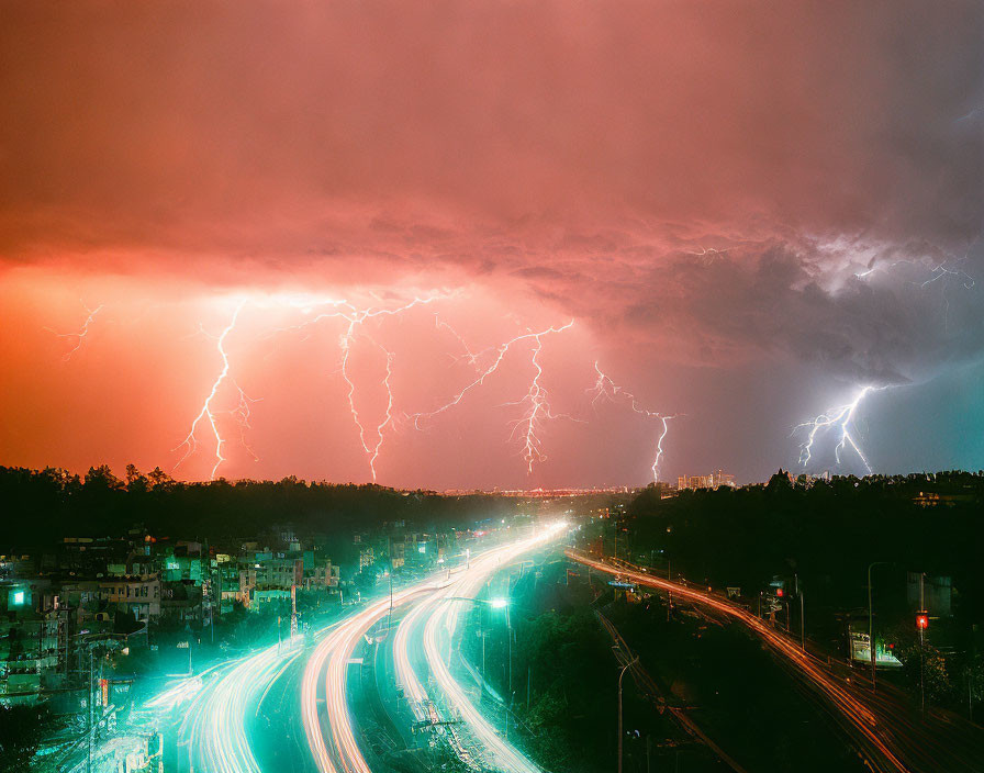 Nighttime cityscape with lightning storm above bright streaks over roads.