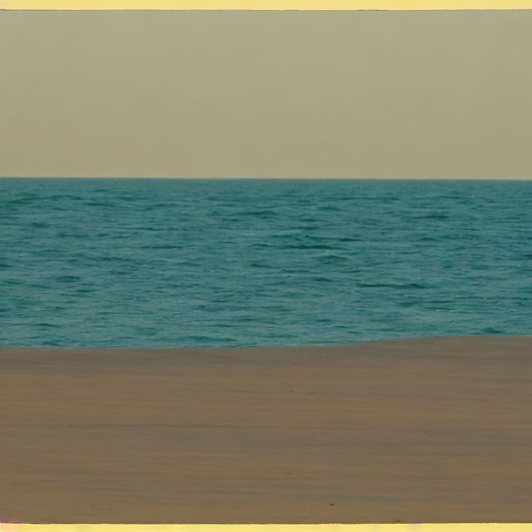 Tranquil Beach Scene with Blue Waters and Sandy Shore