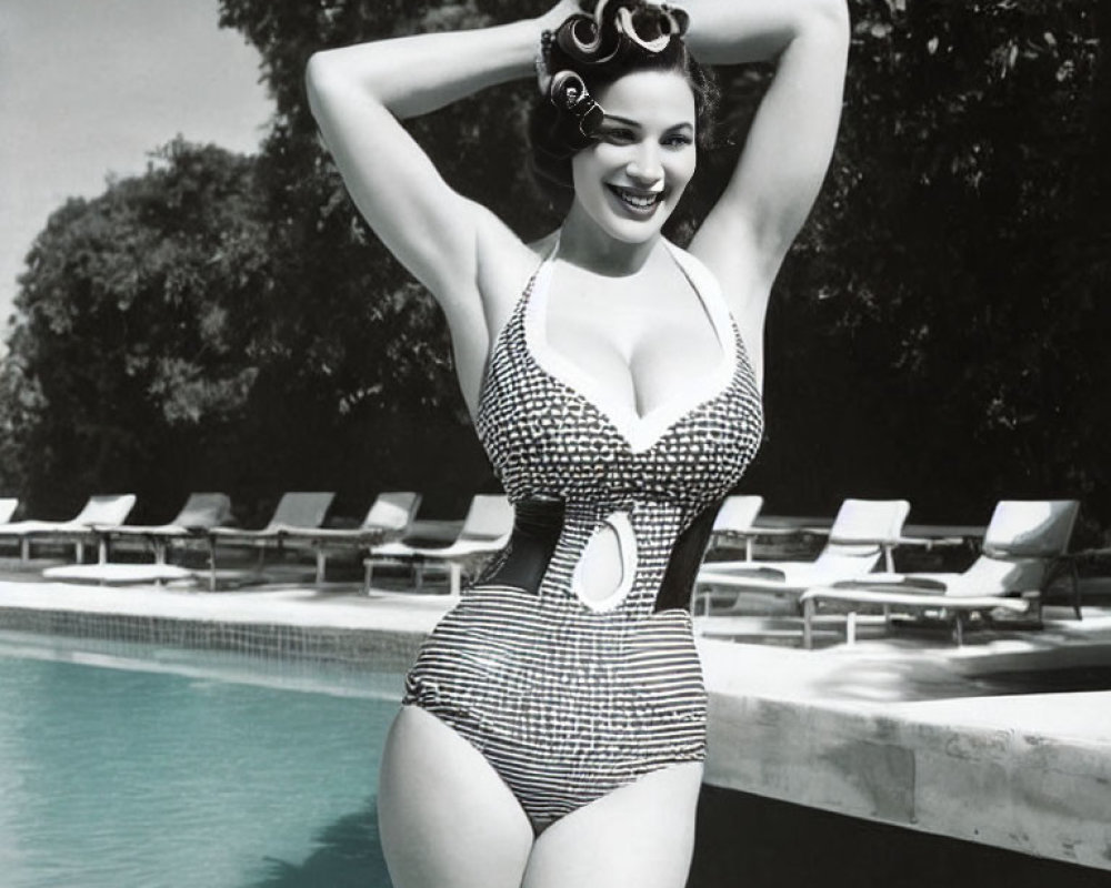 Vintage striped swimsuit woman smiling by pool in black and white photo