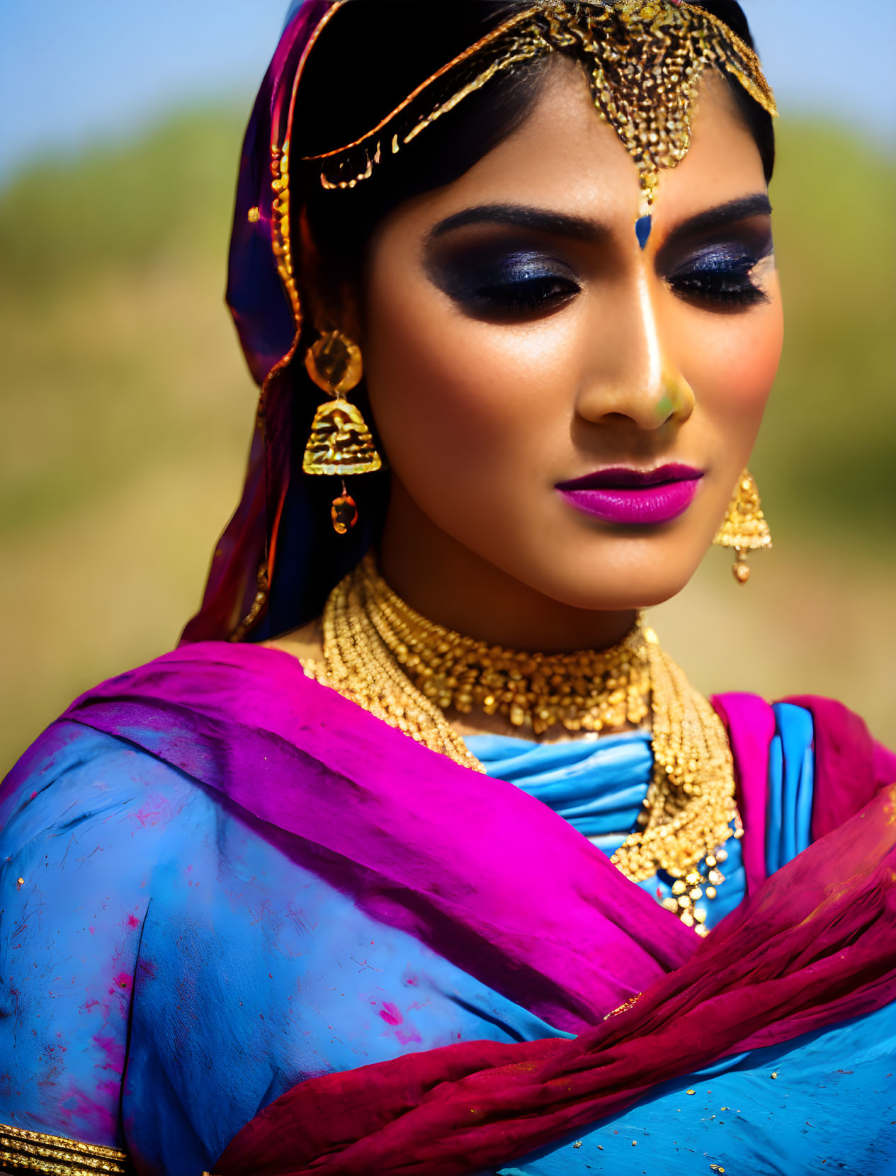 Traditional South Asian Attire and Gold Jewelry on Woman with Makeup