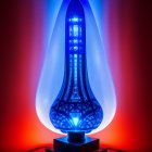 Vibrant blue lava lamp on red and blue gradient background