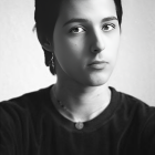 Monochrome portrait of pensive young boy with soft lighting