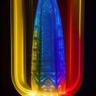 Vibrant Crystal Tower in Translucent Teardrop Shell on Black Background