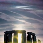 Ancient Stonehenge at Twilight with Sunbeams