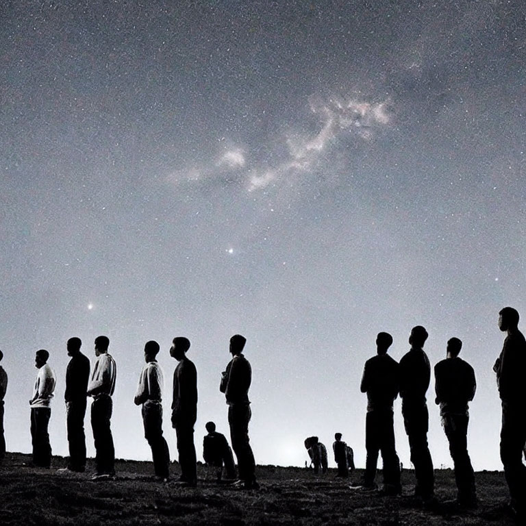 Starry sky with silhouetted figures and galactic cloud