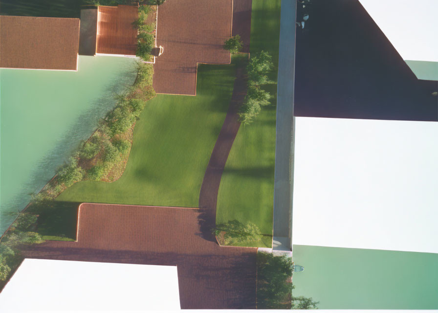 Aerial View of Landscaped Area with Green Lawn and Water Features