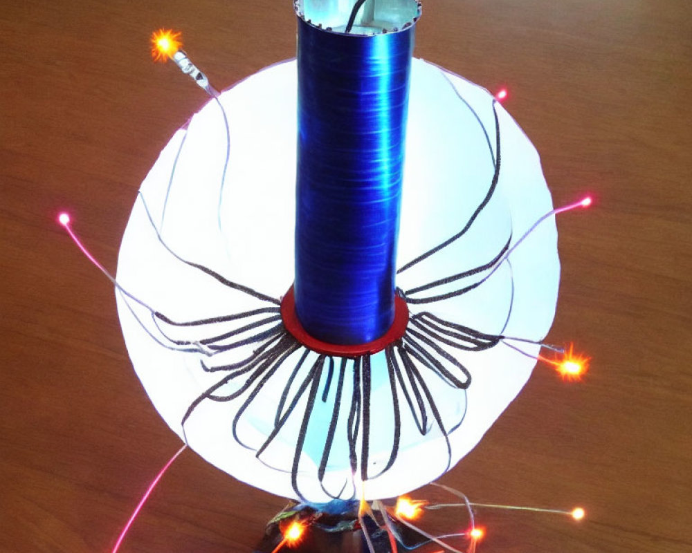 Blue Winding Tesla Coil Emitting Orange and White Sparkles