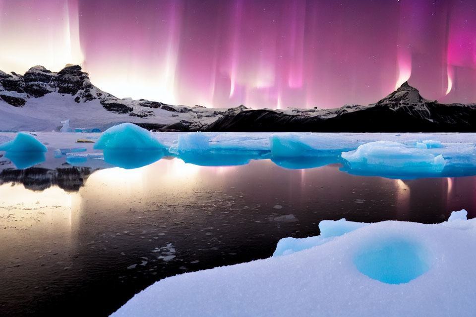 Northern Lights shining over icy glacier chunks and mountains