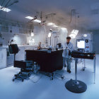 Scientist in white lab coat surrounded by laboratory equipment and American flags