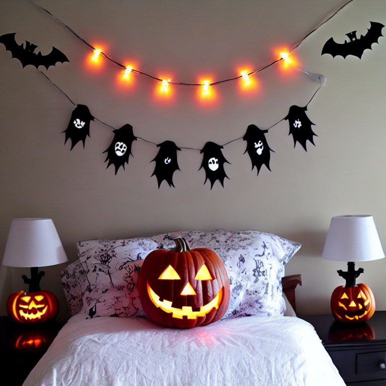 Spooky Halloween bedroom decor with pumpkin lights, jack-o'-lanterns, and bat decorations