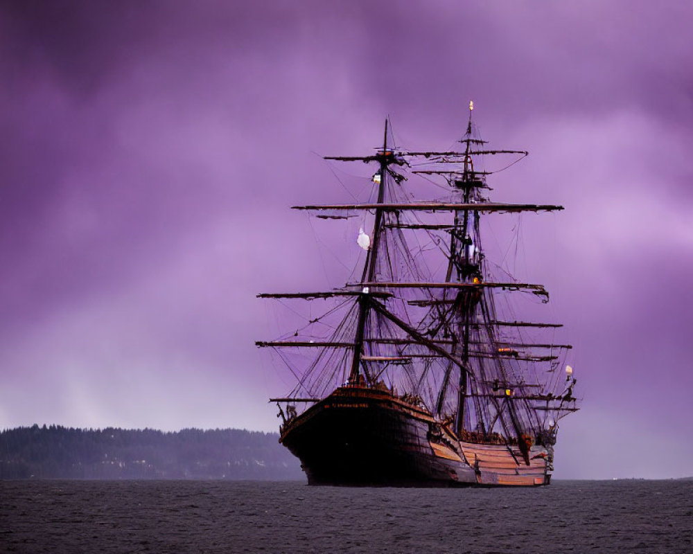 Tall ship with multiple masts on calm water under purple sky