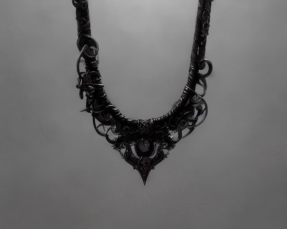 Intricate Black Gothic Necklace with Dark Gemstone on Gray Background