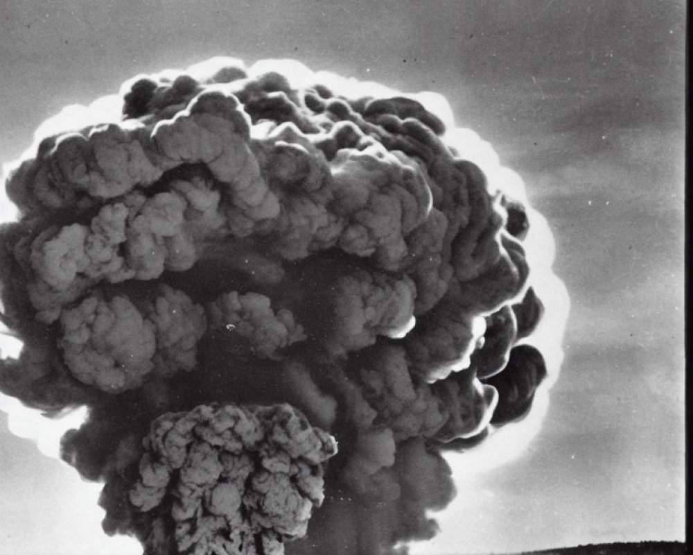 Monochrome image of mushroom cloud explosion aftermath