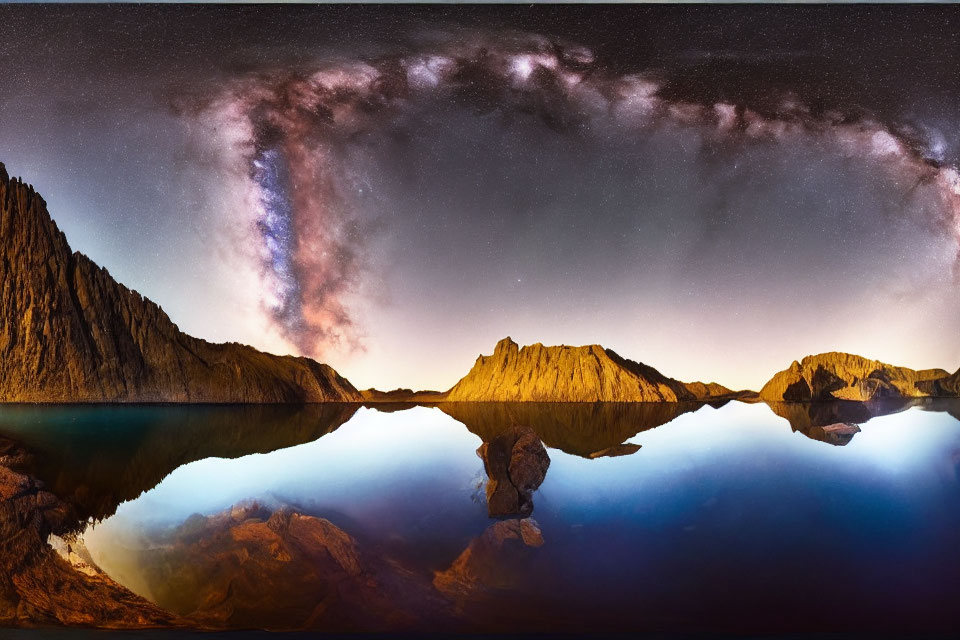 Panoramic view of Milky Way over mountain lake