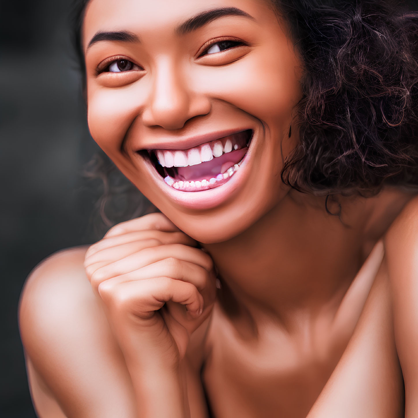 Curly-Haired Woman Smiling Broadly with White Teeth