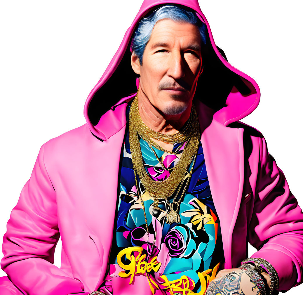 Silver-Haired Man in Pink Hoodie and Blazer with Gold Chains and Graphic Shirt on White Background