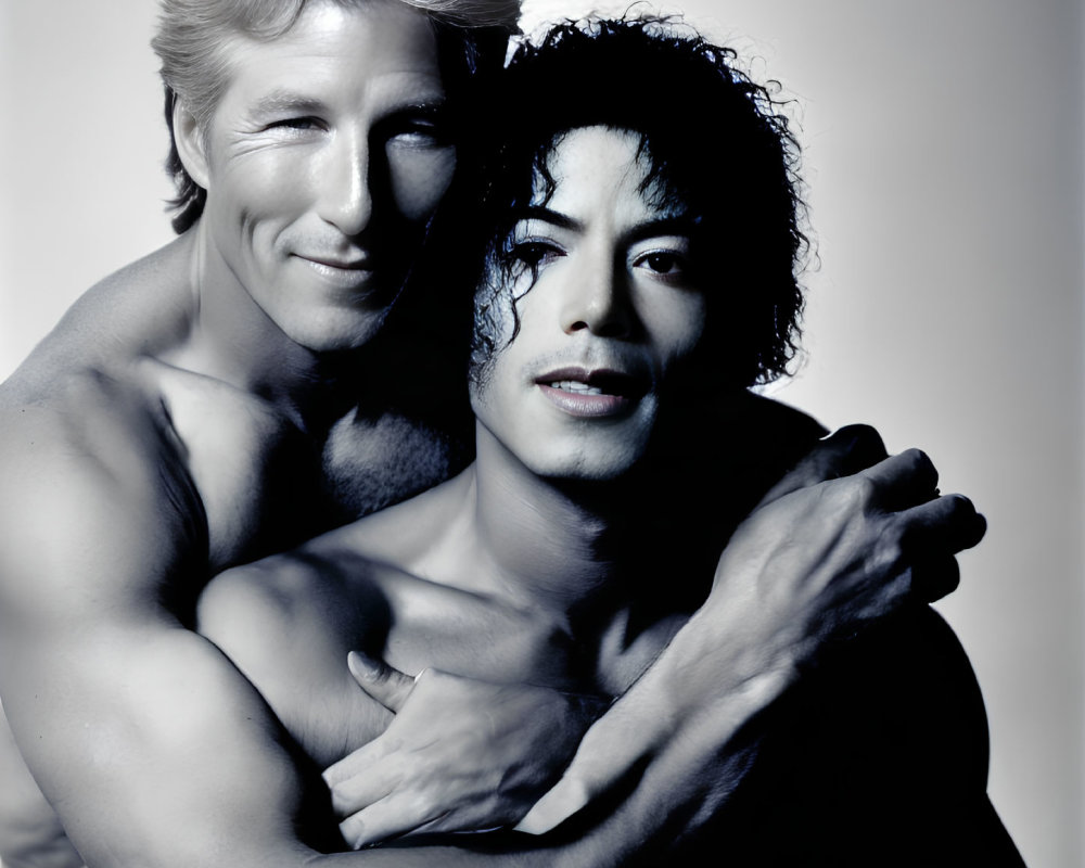 Two men embracing in monochrome portrait.