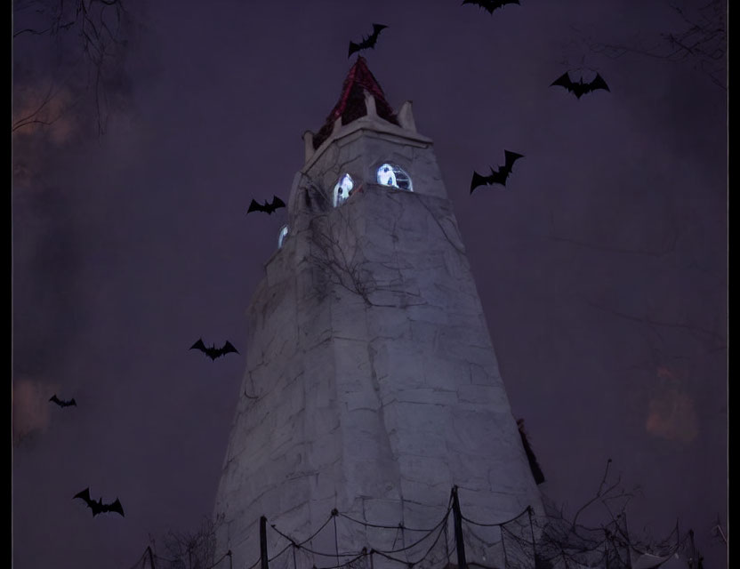 Gothic tower with glowing eyes windows and bats in dusky sky