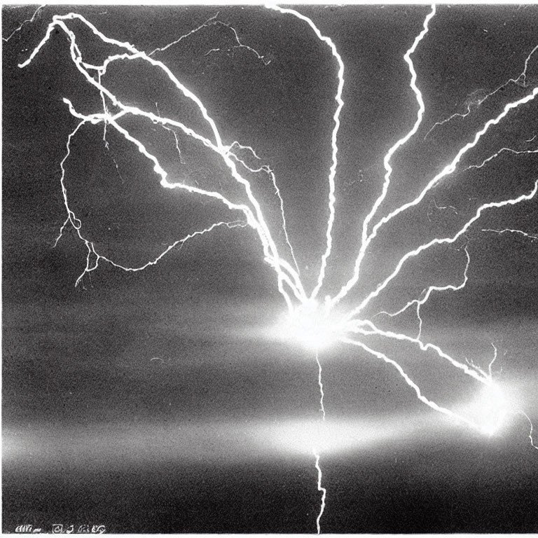 Monochrome image of dramatic lightning bolt branching in sky