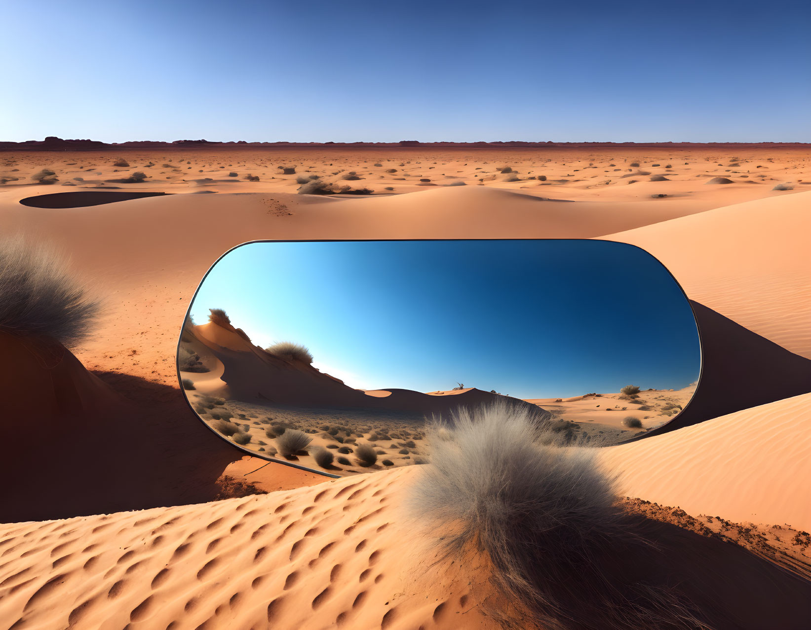 Surreal desert landscape with floating reflective shape