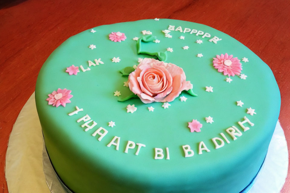 Round Turquoise Fondant Cake with Pink Rose and Cyrillic Lettering