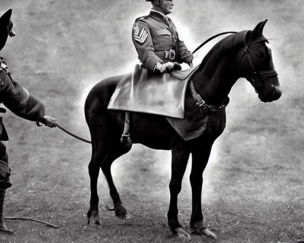 Military person on black horse led by another person on foot in peaked cap