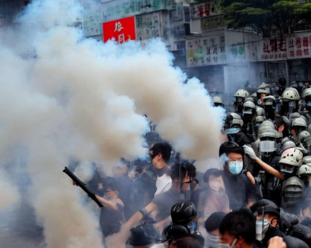 Crowd in Masks and Riot Gear Amid Tear Gas in Cityscape