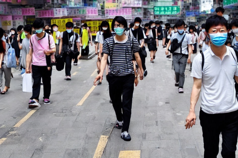 Group of people in masks walking on city street