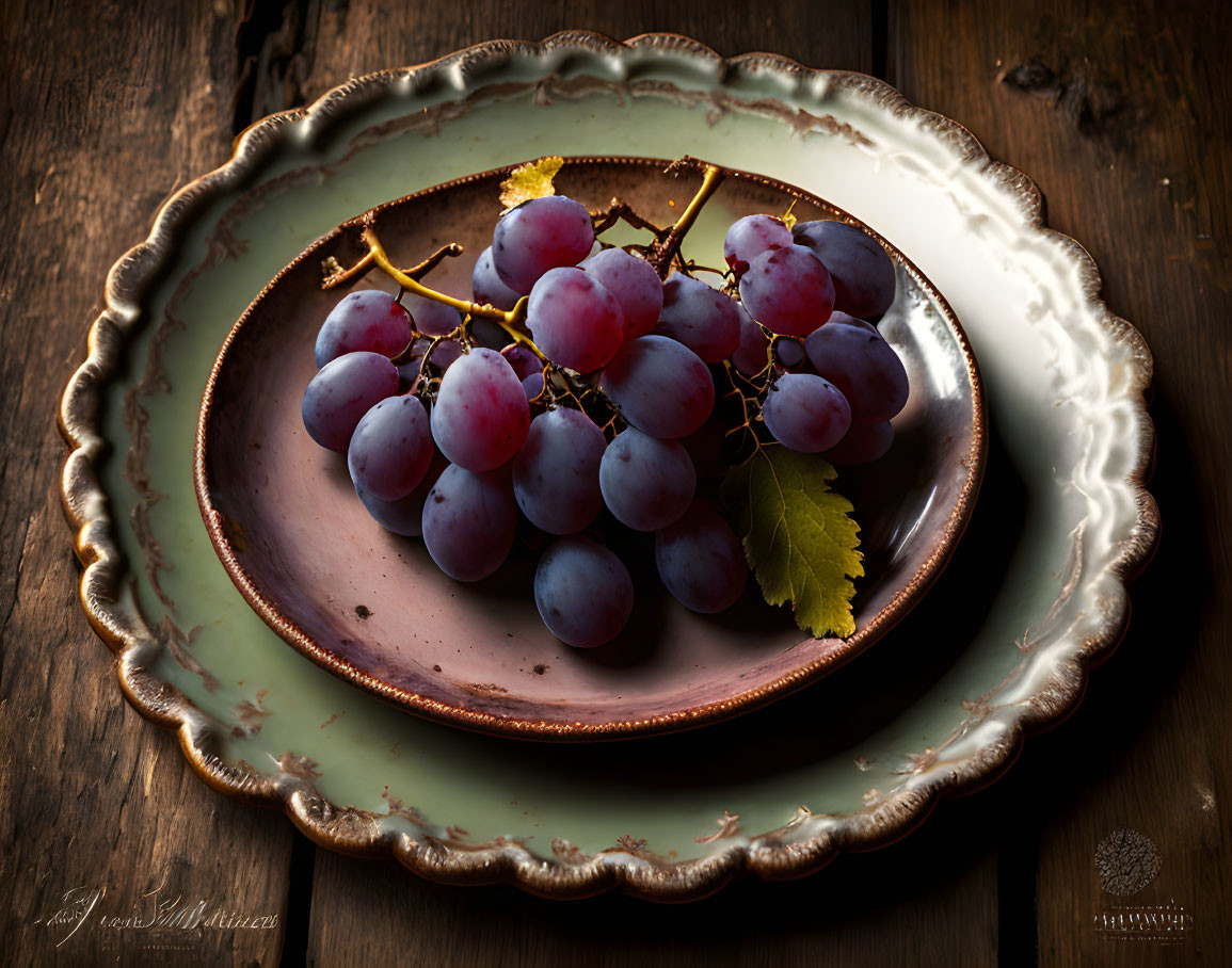 Rustic styled photograph of ripe purple grapes on vintage plate