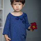 Traditional Asian Attire Woman Portrait in Blue Dress with Red Flower