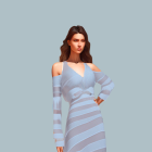 Fashionable woman in blue & white dress with shoulder cutouts on pale blue backdrop