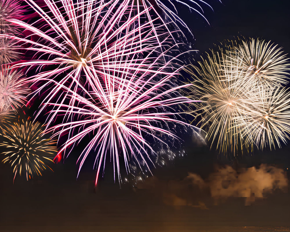 Colorful fireworks light up city night sky in purple, blue, and gold burst.