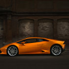 Orange Lamborghini Aventador Parked Against Dark Abstract Background